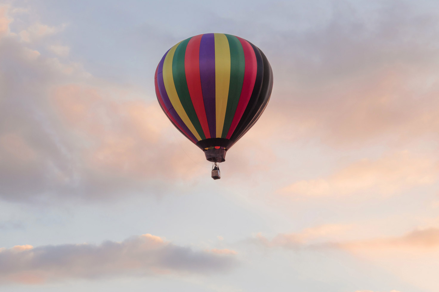 Beautiful rise of colorful hot air balloon at sunrise