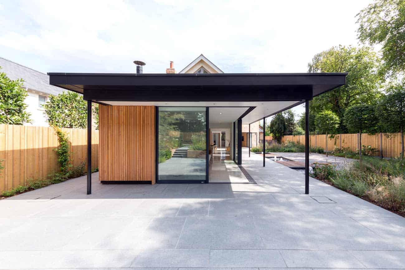 Contemporary mostly glass domestic building set in a designed garden.