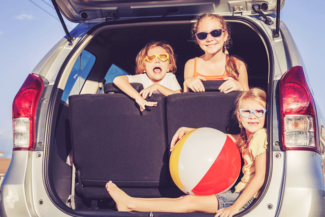 Summer Savings - kids in the car ready for the beach