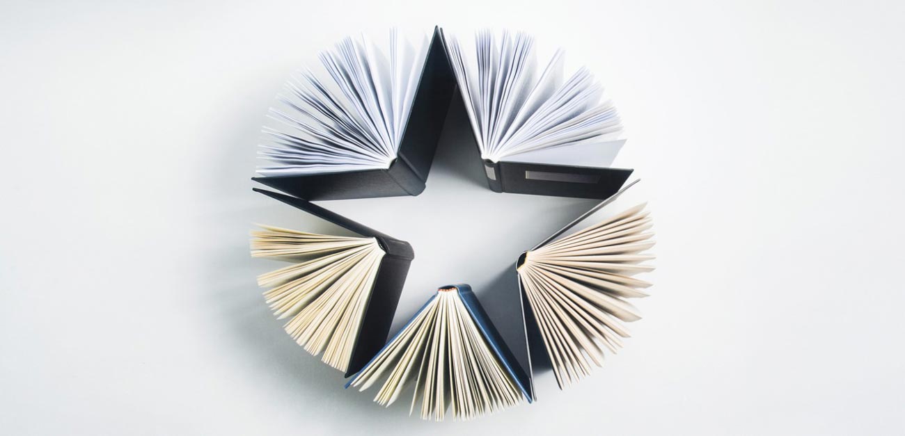 Hard bound books formed into a star