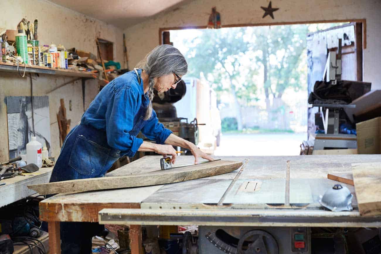Portrait of senior woman inside her wood shop